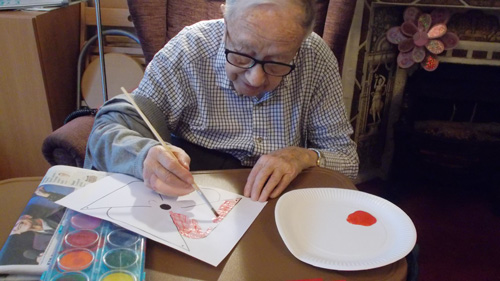 male care client enjoying one of our many activities, arts and crafts